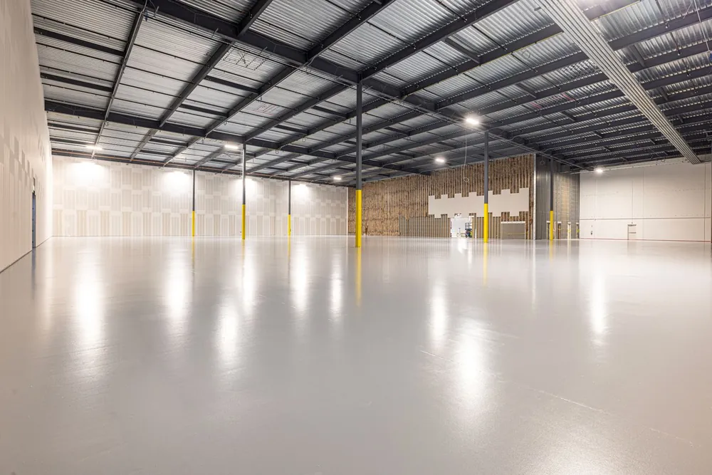 Warehouse interior with a high-gloss epoxy coated concrete floor
