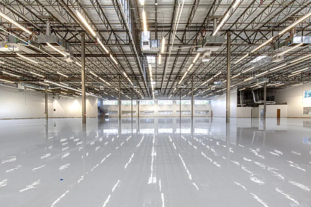 Commercial building interior with a glossy white epoxy floor
